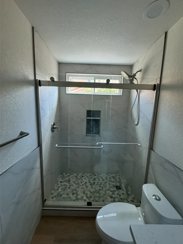 custom shower with pebble tile marble walls bathroom remodel