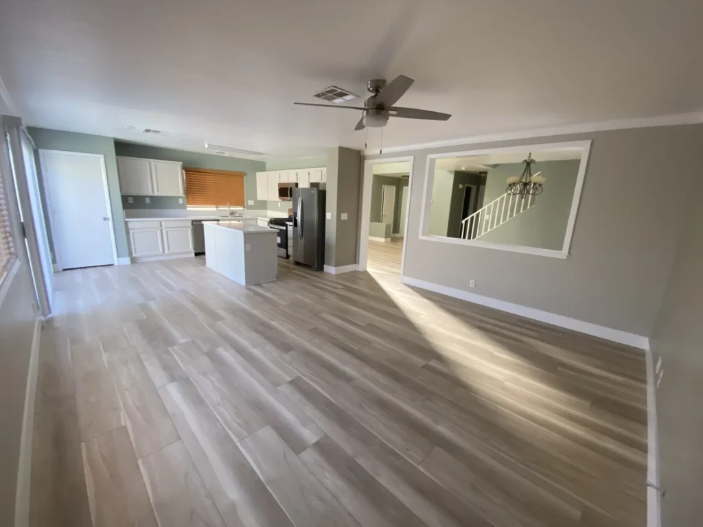 laminate wood plank flooring installation with granite countertop kitchen remodel